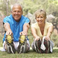 bigstock-Senior-Couple-Exercising-In-Pa-13911026