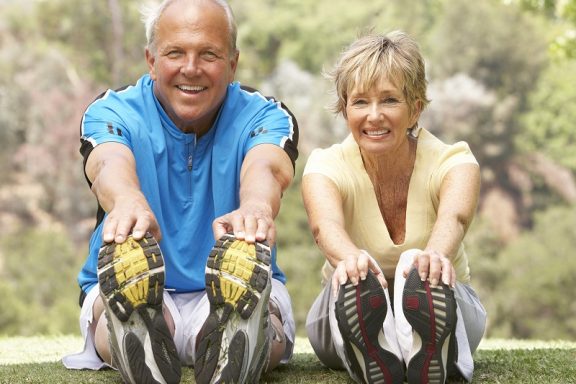 bigstock-Senior-Couple-Exercising-In-Pa-13911026